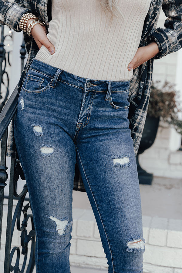 The Jenson Midrise Distressed Ankle Skinny