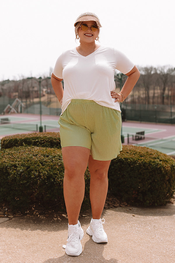 Tour The Town Pleated Shorts In Lime Punch Curves
