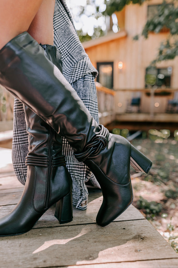 The Eliana Faux Leather Knee High Boot In Black