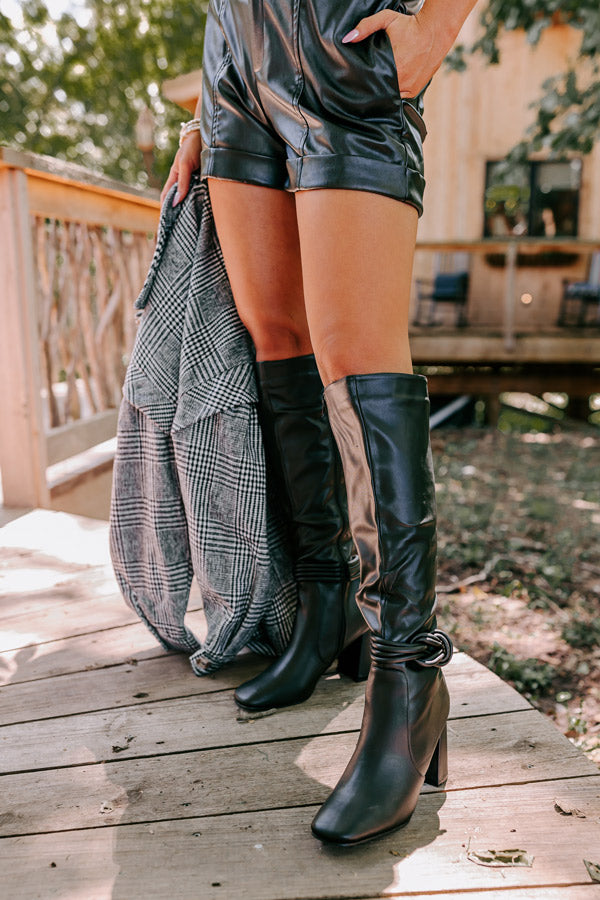 The Eliana Faux Leather Knee High Boot In Black