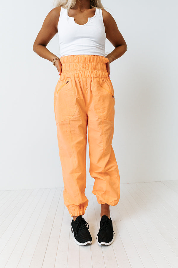 The Huxley High Waist Windbreaker Pants In Neon Orange