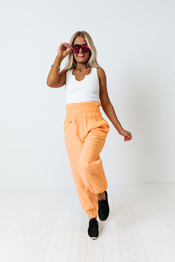 The Huxley High Waist Windbreaker Pants In Neon Orange